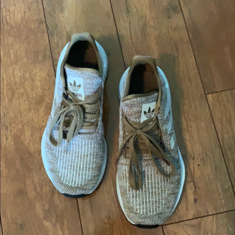 Adidas Otholite tennis shoes.